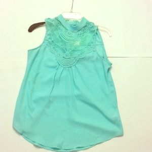 Light turquoise sleeveless blouse